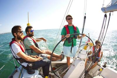 Group sailing in the sunshine on a Dufour 34 Performance on a RYA Competent Crew course