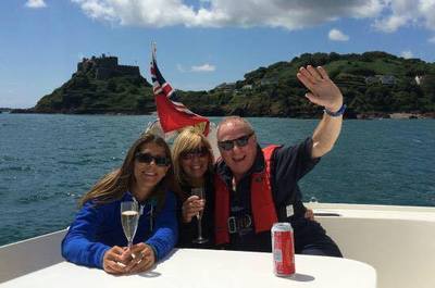 Enjoy a drink whilst sailing past Gorey castle in Jersey