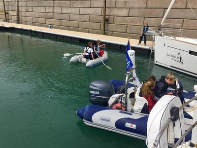 Dinghy rowing practice and close quarter powerboat handling in the marina